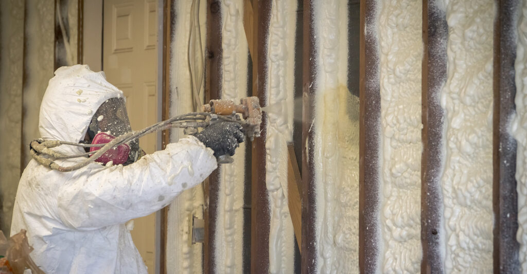 spray foam contractor wearing personal protective equipment